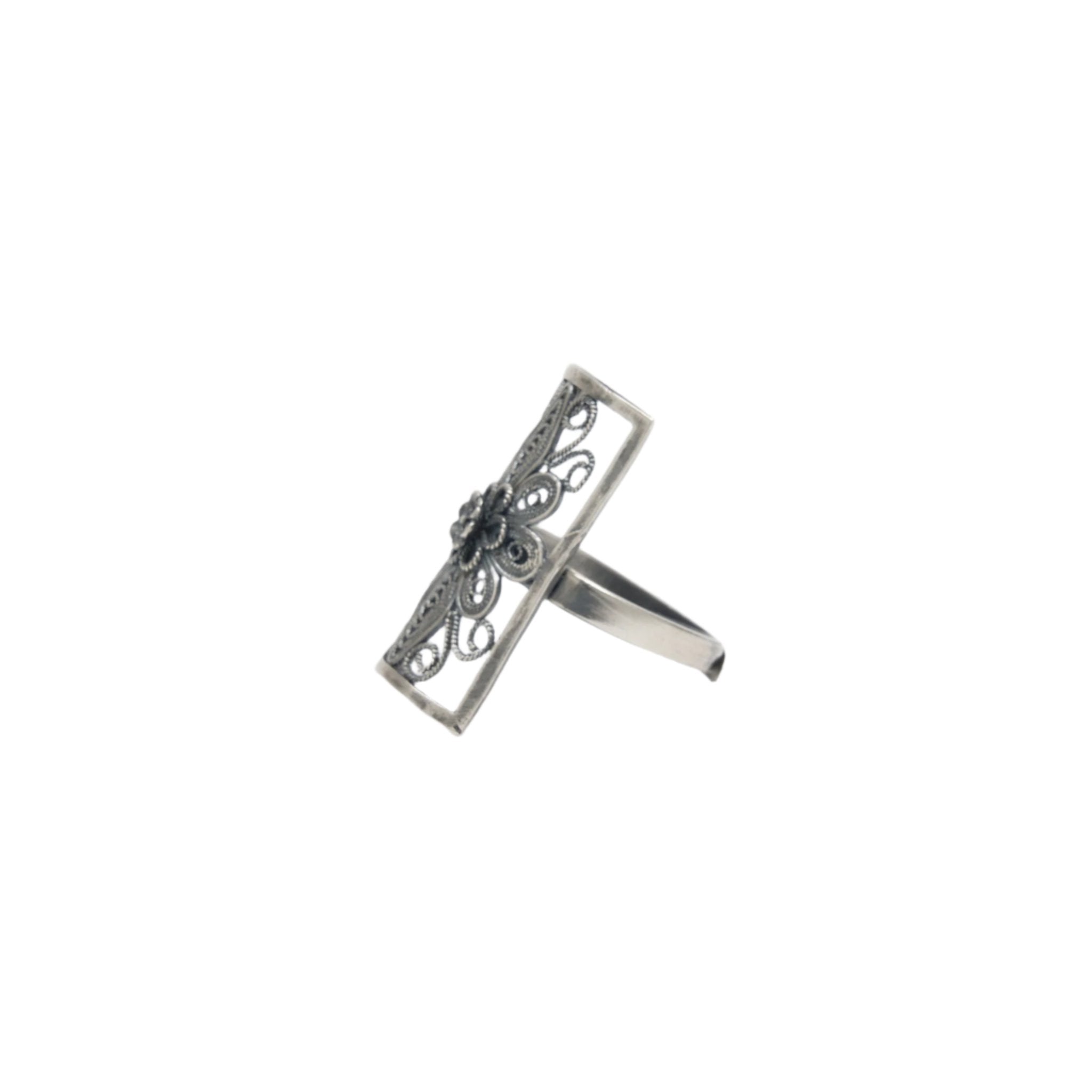 Angled view of Ebnix vintage Classic Filigree Band Ring, highlighting the antique silver floral detailing.