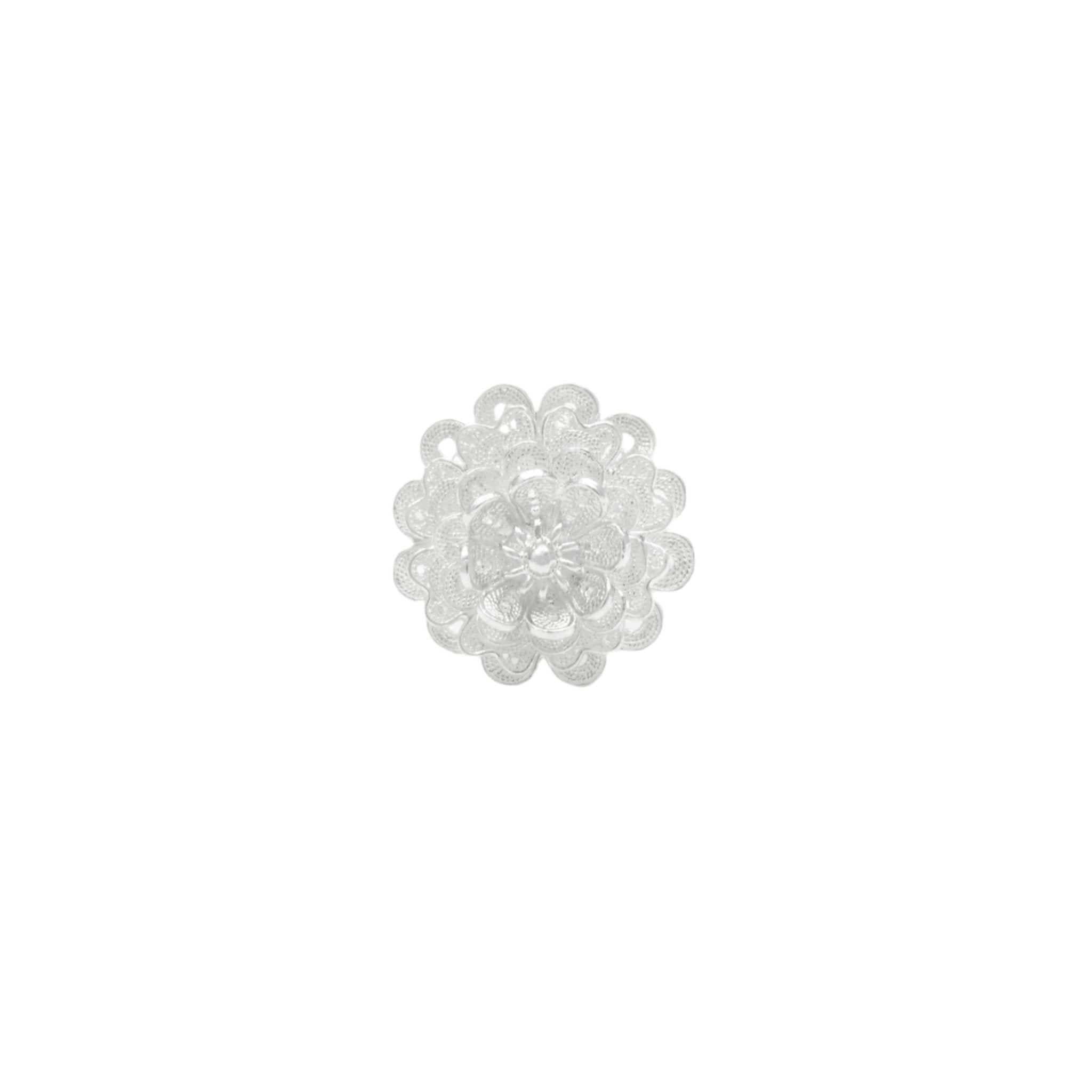 The front of a filigree flower ring with 4 layers of petals made with solid silver